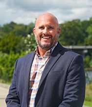 Josh Summits standing in Riverfront Park.
