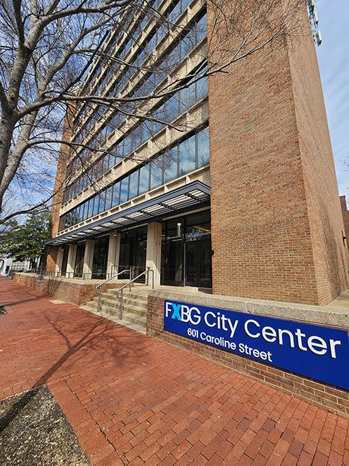 Brick building with seven floors.